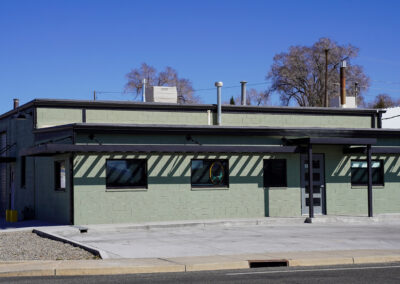 Front of green building exterior.