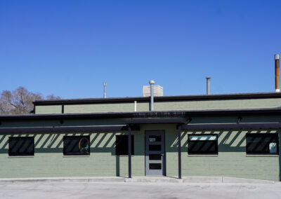Front of green building exterior.