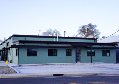 Front of green building exterior.
