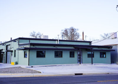 Front of green building exterior.