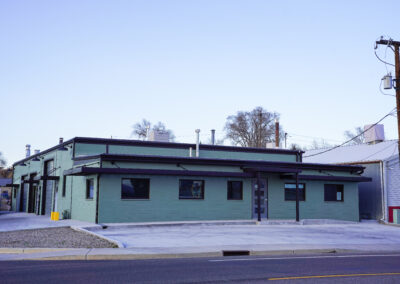 Green building exterior view from street.