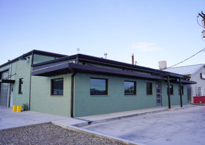 Green building exterior view from street.