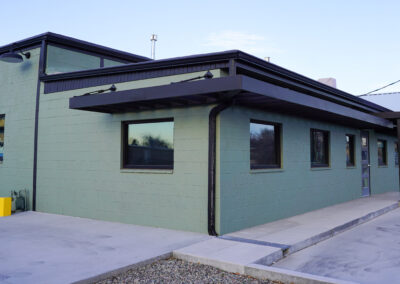 Green building exterior view from street.