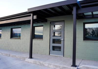 Green building exterior view from front door.