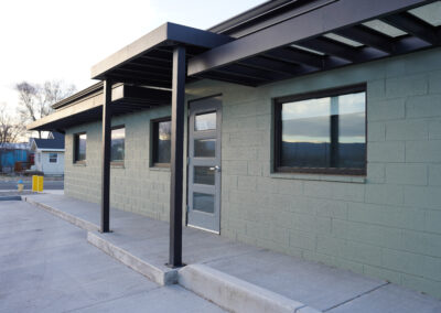 Green building exterior view from front door.