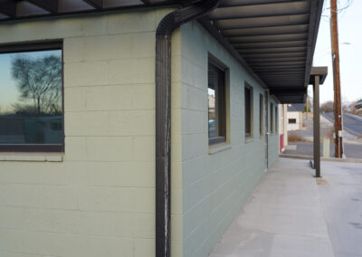 Green building exterior from side.