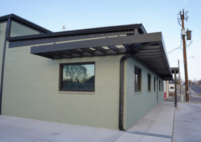 Green building exterior from side.